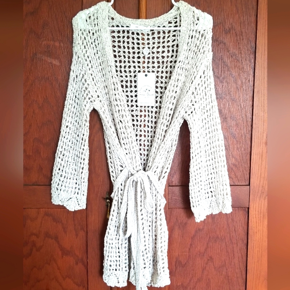 NWT Beautiful crocheted sweater. Cream with front tie. By Miracle. Fits XS and S